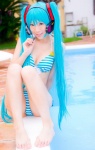 aqua_hair bikini cleavage cosplay hatsune_miku headset mashiro_yuki pool project_diva swimsuit twintails vocaloid rating:Safe score:2 user:nil!