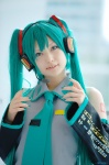 aqua_hair beng cosplay default_costume detached_sleeves hatsune_miku headset pleated_skirt skirt tie twintails vocaloid rating:Safe score:0 user:nil!