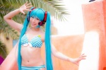 aqua_hair bikini cleavage cosplay hatsune_miku headset mashiro_yuki project_diva swimsuit twintails vocaloid rating:Safe score:0 user:nil!