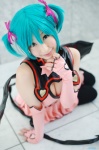 aqua_hair chii cleavage cosplay dress elbow_gloves fingerless_gloves garter_belt gloves hairbows hatsune_miku project_diva stirrup_socks tail twintails vocaloid wings world_is_mine_(vocaloid) rating:Safe score:2 user:nil!