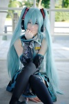 aqua_hair blouse cosplay detached_sleeves hatsune_miku headset pleated_skirt popuri skirt thighhighs tie twintails vocaloid zettai_ryouiki rating:Safe score:2 user:nil!