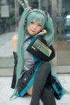 aqua_hair blouse cosplay detached_sleeves hatsune_miku headset maitako pleated_skirt skirt thighhighs tie twintails vocaloid rating:Safe score:3 user:pixymisa