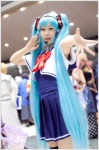 aqua_hair bowtie cosplay dress hatsune_miku headset pleated_skirt skirt thighhighs twintails vest vocaloid yukimura_suzuran zettai_ryouiki rating:Safe score:1 user:pixymisa