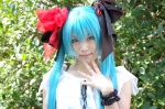 aqua_eyes aqua_hair cosplay dress hairbows hatsune_miku iori necklace twintails vocaloid wristband rating:Safe score:2 user:pixymisa