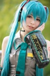 aqua_hair asami_uki blouse cosplay detached_sleeves hatsune_miku headset tie twintails vocaloid rating:Safe score:0 user:nil!