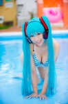 aqua_hair bikini cleavage cosplay hatsune_miku headset mashiro_yuki pool project_diva swimsuit twintails vocaloid wet rating:Safe score:1 user:nil!
