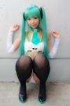 aqua_hair bikini cosplay detached_sleeves hatsune_miku necoco skirt swimsuit thighhighs twintails vocaloid rating:Safe score:2 user:pixymisa