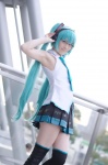 aqua_hair black_legwear cosplay glasses hatsune_miku headset pleated_skirt popuri skirt sleeveless_blouse thighhighs tie twintails vocaloid zettai_ryouiki rating:Safe score:5 user:nil!