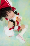 boots cosplay detached_sleeves hairbow hakurei_reimu kneepads lenfried miko one-piece_swimsuit sideboob swimsuit thighhighs touhou rating:Safe score:0 user:nil!
