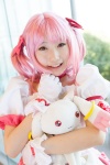 bows choker cosplay dress gloves hairbow kaname_madoka kujyou_konegi pink_hair plushie puella_magi_madoka_magica red_eyes tiered_skirt twintails rating:Safe score:0 user:pixymisa