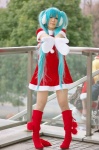 aqua_hair boots cosplay dress ear_muffs haru_mizuki hatsune_miku mittens santa_costume twintails vocaloid rating:Safe score:3 user:nil!
