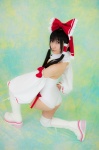 ass boots cosplay detached_sleeves hairbow hakurei_reimu kneepads lenfried miko one-piece_swimsuit swimsuit thighhighs touhou rating:Safe score:0 user:nil!