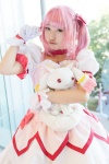 bows choker cosplay dress gloves hairbow kaname_madoka kujyou_konegi pink_hair plushie puella_magi_madoka_magica red_eyes tiered_skirt twintails rating:Safe score:0 user:pixymisa