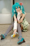 aqua_hair colorful_x_melody_(vocaloid) cosplay detached_sleeves dress hatsune_miku microphone project_diva saya thighhighs twintails vocaloid zettai_ryouiki rating:Safe score:2 user:nil!