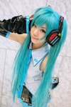 aqua_hair cosplay default_costume detached_sleeves hatsune_miku headset kousaka_yun pleated_skirt skirt tie twintails vocaloid rating:Safe score:1 user:nil!