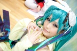 aqua_hair cosplay detached_sleeves dress hatsune_miku headdress jiruko twintails vocaloid rating:Safe score:1 user:pixymisa