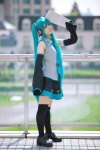 aqua_hair ayaki blouse cosplay detached_sleeves hatsune_miku headset pleated_skirt skirt thighhighs tie twintails vocaloid zettai_ryouiki rating:Safe score:3 user:nil!