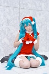 aqua_hair boots cosplay dress fuuka_(iv) gloves hatsune_miku santa_costume stocking_cap tagme_song twintails vocaloid rating:Questionable score:1 user:nil!