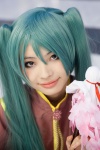 aqua_hair blouse cosplay hatsune_miku military_uniform nakko twintails vocaloid rating:Safe score:0 user:pixymisa