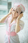 cosplay dress headphones kaori_(ii) nitro_super_sonic nurse nurse_cap nurse_uniform pink_hair super_soniko rating:Safe score:1 user:nil!