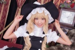 apron bed blonde_hair cosplay dress kirisame_marisa love_saotome skirt touhou vest witch_hat rating:Safe score:0 user:nil!