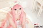 bed cleavage cosplay dress hairband megurine_luka pink_hair saku twintails vocaloid world_is_mine_(vocaloid) rating:Safe score:2 user:nil!