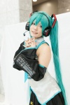 aqua_hair blouse blue_eyes chica cosplay detached_sleeves hatsune_miku headset pleated_skirt skirt twintails vocaloid rating:Safe score:0 user:pixymisa