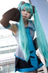 aiko aqua_hair cosplay default_costume detached_sleeves hatsune_miku headset pleated_skirt skirt tie twintails vocaloid rating:Safe score:0 user:nil!