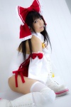 bodysuit boots cosplay detached_sleeves hairbow hakurei_reimu kneepads lenfried miko thighhighs touhou rating:Safe score:1 user:nil!