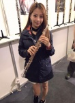 asian brown_hair earrings east_asian hoop_earrings instrument instrument_stand jacket long_sleeves oboe poster_(object) taiwanese wendy_wen rating:Safe score:0 user:zuxvejq