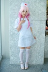 cosplay dress dress_lift guilty_crown kuuta nurse nurse_cap nurse_uniform pink_hair thighhighs yuzuriha_inori zettai_ryouiki rating:Safe score:3 user:nil!