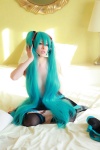 aqua_hair arai_yomi bed cleavage cosplay hatsune_miku headset pleated_skirt skirt thighhighs topless twintails vocaloid rating:Questionable score:2 user:nil!