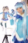 blue_hair bowtie coat cosplay ear_muffs hatsune_miku mittens necoco pleated_skirt skirt twintails vocaloid yuki_miku rating:Safe score:0 user:pixymisa