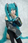 aqua_hair cosplay detached_sleeves hatsune_miku headset pleated_skirt skirt thighhighs tie twintails uta vocaloid rating:Safe score:0 user:pixymisa