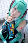 aqua_hair blouse cosplay default_costume detached_sleeves hatsune_miku headphones microphone miniskirt pleated_skirt shii skirt thighhighs tie twintails vocaloid rating:Safe score:0 user:nil!