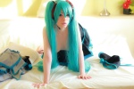 aqua_hair arai_yomi bed cleavage cosplay hatsune_miku headset pleated_skirt skirt thighhighs topless twintails vocaloid rating:Questionable score:3 user:nil!