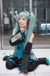 aqua_hair blouse cosplay detached_sleeves hatsune_miku headset maitako pleated_skirt skirt thighhighs tie twintails vocaloid rating:Safe score:1 user:pixymisa