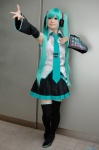 aqua_hair cosplay default_costume detached_sleeves hatsune_miku headset pleated_skirt skirt thighhighs tie twintails vocaloid zettai_ryouiki rating:Safe score:0 user:nil!