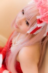 cinnamon_roll_(vocaloid) corset cosplay elbow_gloves gloves hairbow megurine_luka pink_hair roses skirt vocaloid yomogi_yue rating:Safe score:0 user:xkaras