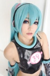 aira aqua_hair cosplay croptop detached_sleeves elbow_gloves gloves hatsune_miku headset project_diva shorts twintails vocaloid rating:Safe score:1 user:xkaras
