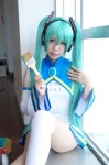 aqua_hair cosplay detached_sleeves hatsune_miku headset kuzui_azuki miracle_paint_(vocaloid) one-piece_swimsuit paintbrush pantyhose single_thighhigh swimsuit thighhighs twintails vocaloid rating:Safe score:0 user:nil!