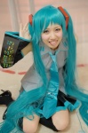 aqua_hair blouse cosplay detached_sleeves hatsune_miku mero pleated_skirt skirt thighhighs tie twintails vocaloid zettai_ryouiki rating:Safe score:1 user:nil!