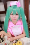 aqua_hair cosplay doughnut hatsune_miku hiiragi_haruka nurse nurse_cap nurse_uniform tea twintails vocaloid rating:Safe score:0 user:pixymisa