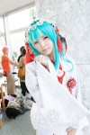 aqua_eyes cosplay hatsune_miku hood maitako multi-colored_hair robe tassels vocaloid rating:Safe score:2 user:pixymisa