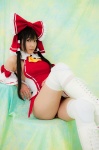boots cosplay detached_sleeves hairbow hakurei_reimu kneepads lenfried miko one-piece_swimsuit swimsuit thighhighs touhou rating:Safe score:1 user:nil!