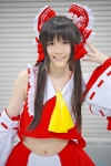 blouse cosplay croptop detached_sleeves hairbow hakurei_reimu miko miniskirt popuri skirt touhou rating:Safe score:0 user:nil!
