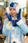 blouse blue_eyes cosplay ear_muffs gloves hairbow hatsune_miku headset multi-colored_hair ran_(ii) twintails vocaloid rating:Safe score:0 user:pixymisa