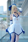 ageha blonde_hair blue_eyes choker cosplay dress elbow_gloves fate/series fate/stay_night gloves hairbow pointed_skirt saber skirt_train sword thighhighs zettai_ryouiki rating:Safe score:1 user:pixymisa