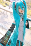 aqua_hair cosplay default_costume detached_sleeves hatsune_miku headset pleated_skirt sajou_erio skirt tie twintails vocaloid rating:Safe score:1 user:nil!