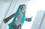 aqua_hair beng cosplay default_costume detached_sleeves hatsune_miku headset pleated_skirt skirt tie twintails vocaloid rating:Safe score:1 user:nil!